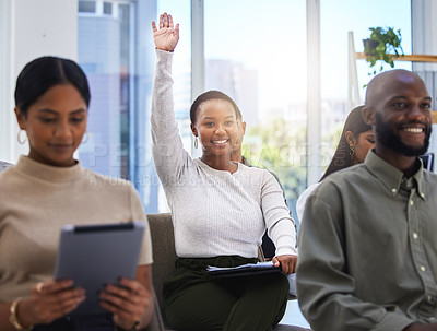 Buy stock photo Shot of a young woman raising her hand in a meeting at work in modern office