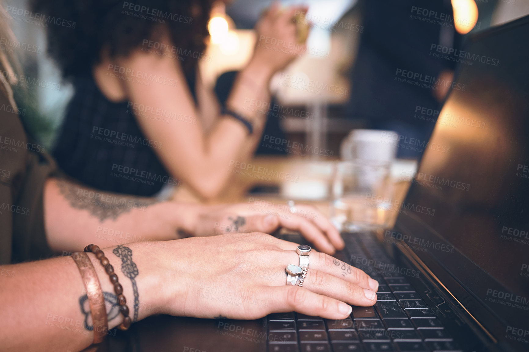 Buy stock photo Shot of an unrecognisable businesswoman using a laptop during a meeting in the boardroom of a modern office