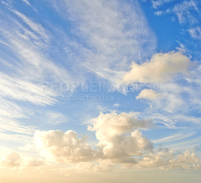 Buy stock photo Cumulus cloud with sun shining on it. Beautiful scenery of the heavens and atmosphere with fluffy clouds, sunlight and flare. Cloudscape copy space of a bright sky on a sunny summer day from below
