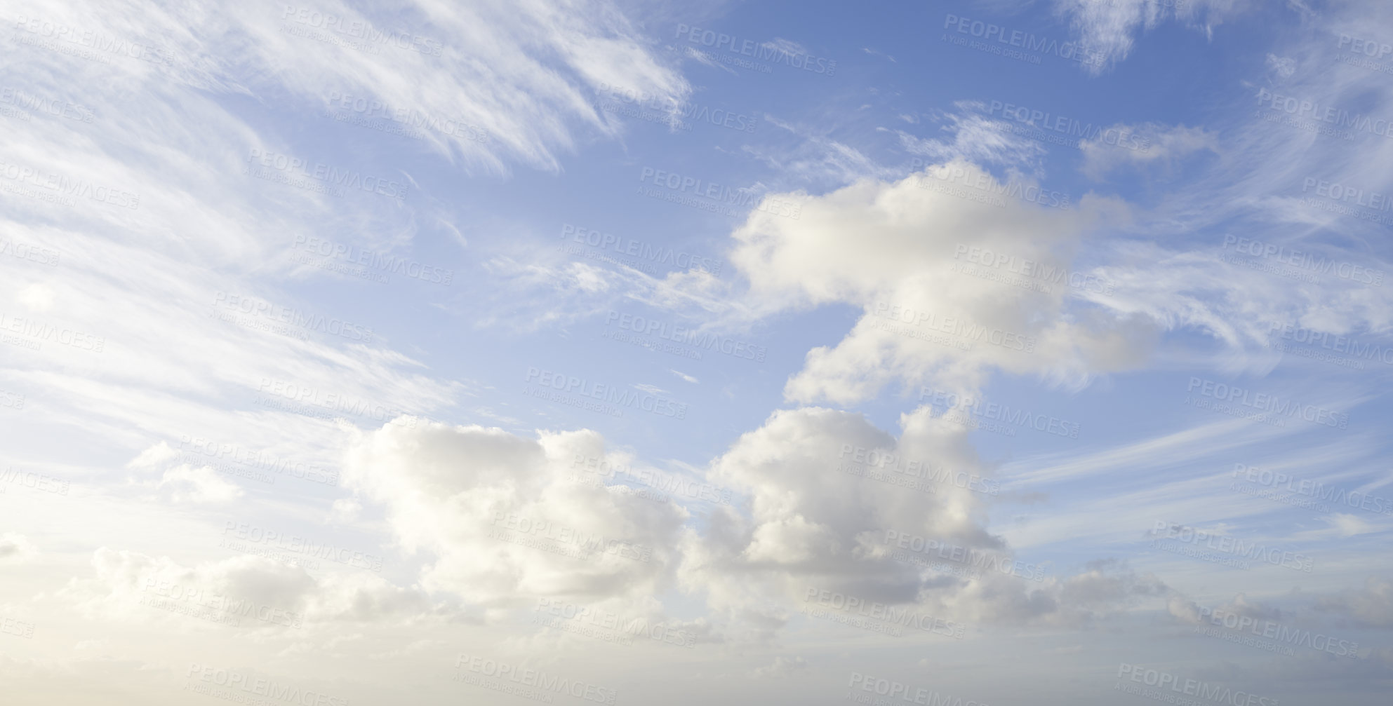 Buy stock photo Cloudy blue sky with fluffy clouds as a natural background on a summer day. Landscape view of cumulus forming with copy space. High scenic and copyspace views of the atmosphere and the climate