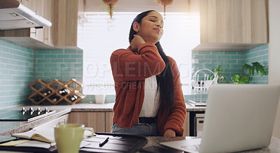 Buy stock photo Shot of a young businesswoman suffering from a neck cramp while working at home