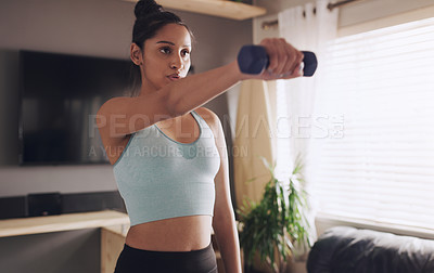 Buy stock photo Dumbbell, woman and training in home for fitness, wellness and sports equipment for healthy body. Muscle, weightlifting and strong girl workout, exercise and serious bodybuilder with power in house
