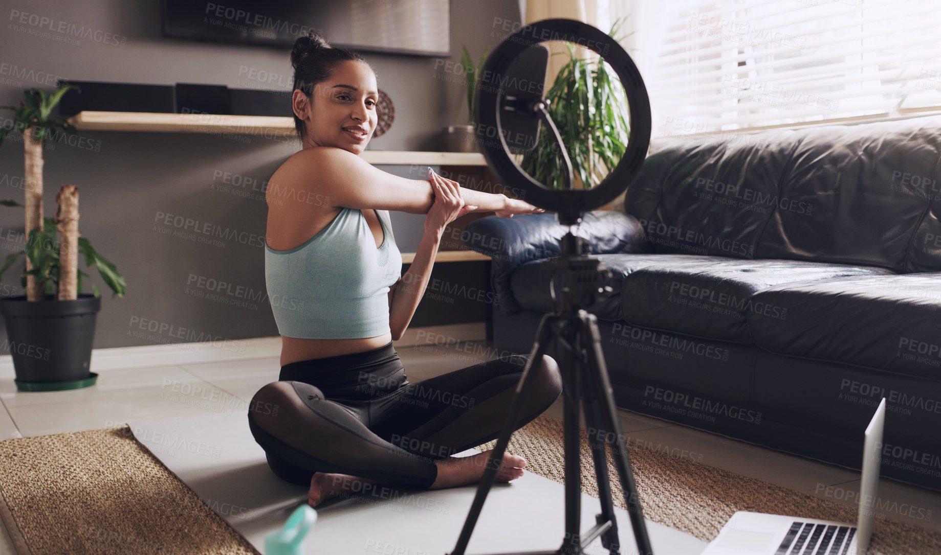 Buy stock photo Live streaming, phone and stretching with woman in living room for social media, workout and yoga teacher. Exercise, internet and recording with influencer at home for blog, training and vlogger