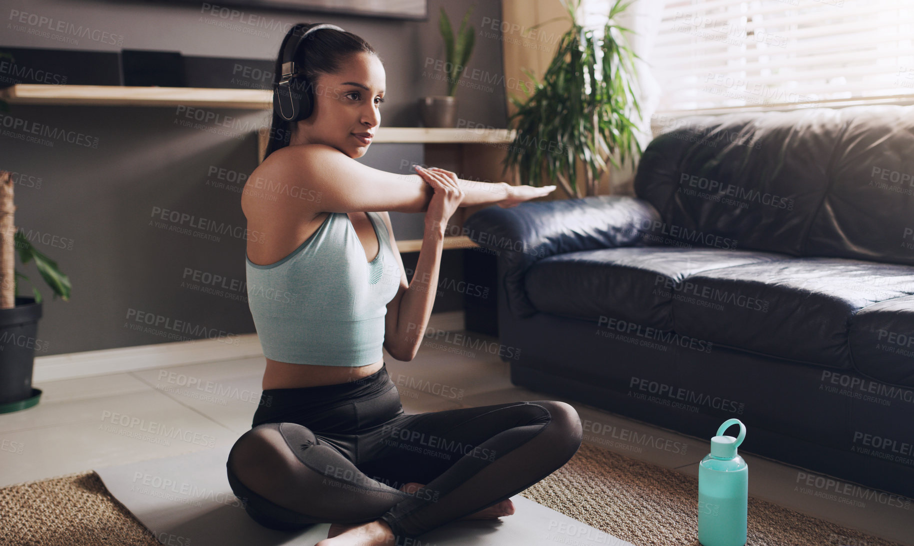 Buy stock photo Fitness, stretching and woman on mat with headphones for cardio, exercise or podcast in workout. Female person, thinking and training with music at home for streaming, warm up and self care on floor