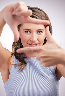 Buy stock photo Woman, studio and frame hands with fingers, photography and profile picture or perspective with hand gesture. Focus, camera sign and portrait or looking, happy and confident face on background