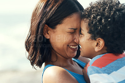 Buy stock photo Shot of a mother and son being affectionate on the beach