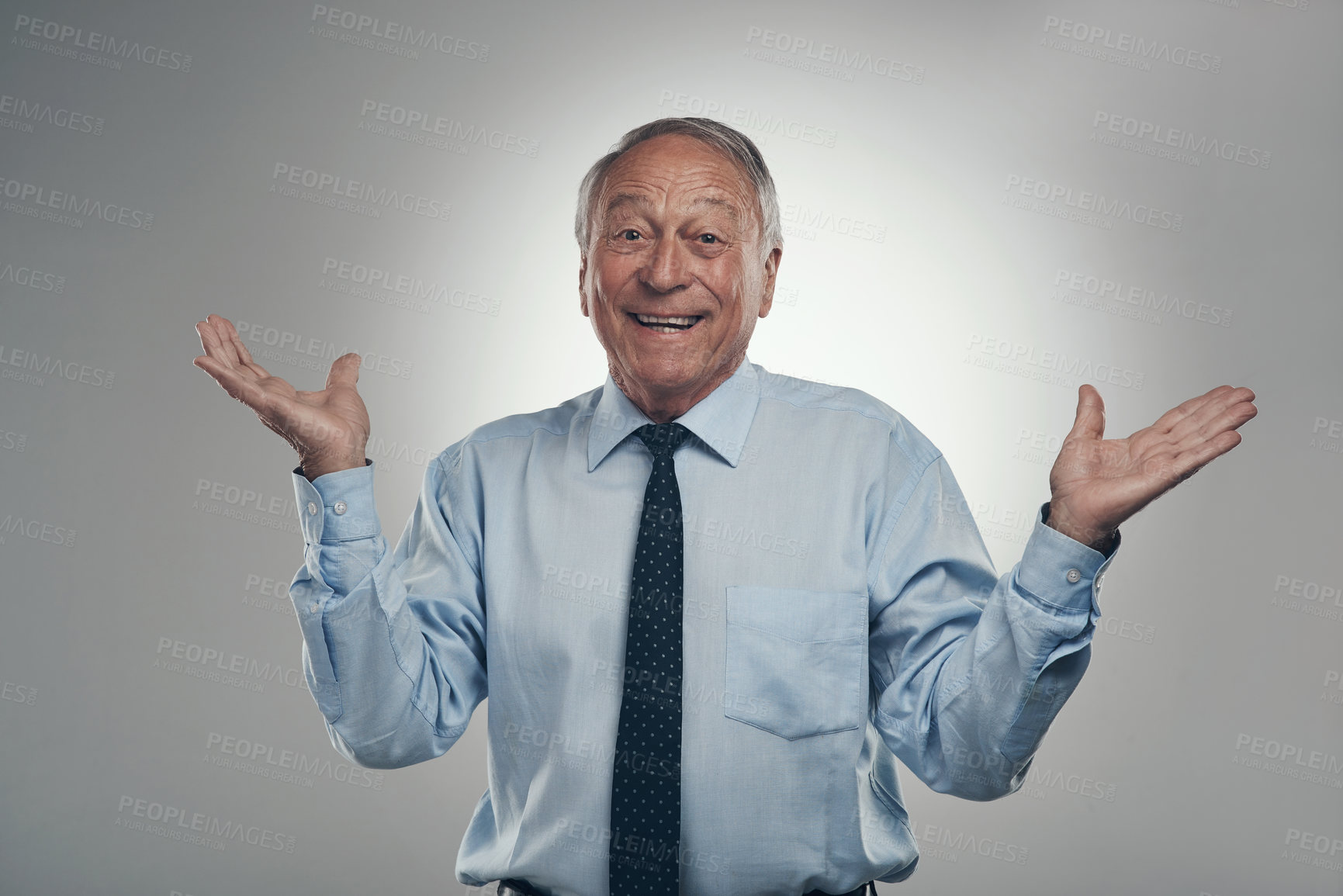 Buy stock photo Shot of a senior businessman standing against a grey background in the studio and making a choice between two options