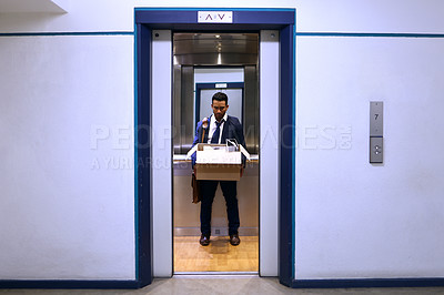 Buy stock photo Businessman, fired and sad with box in elevator with unemployment, failure and disappointed or frustrated. Professional, employee and helpless in lift of office building with bag, leaving and stress