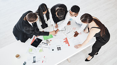 Buy stock photo Meeting, finance and teamwork with a business team working around a table in the boardroom from above. Accounting, documents and collaboration with a man and woman employee group at work in an office