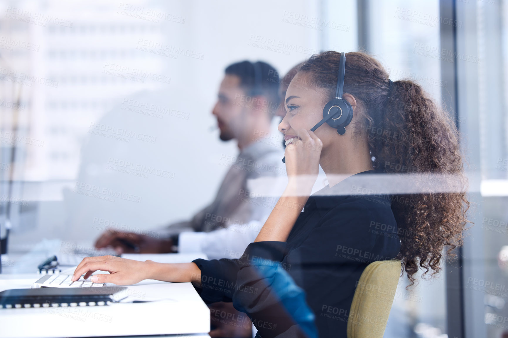 Buy stock photo Call center, customer service and glass with a black woman consultant working in her telemarketing office. Contact us, crm and communication with a female consulting at work using a headset