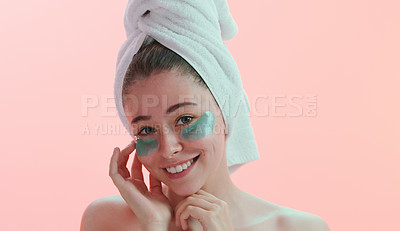 Buy stock photo Portrait, woman and skincare with eye mask in studio happy with beauty, collagen and anti aging on pink background. Face, patches and female model with skin cosmetics, facial and vitamin c treatment
