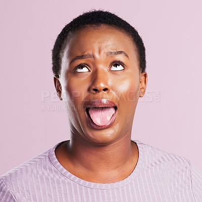 Buy stock photo Black woman, face and tongue out in studio with funny for comic meme, silly comedy and eye roll. African girl, pink background and crazy emoji with mouth for weird expression and wild or goofy person