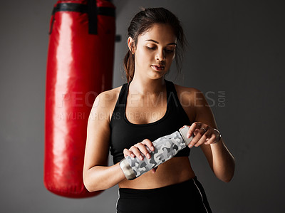 Buy stock photo Sports, boxer or woman drinking water on break in boxing training, exercise or workout in gym studio. Punching bag, tired athlete or exhausted girl with fatigue, fitness or bottle on grey background