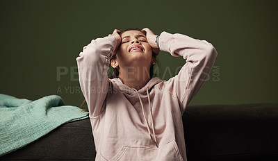 Buy stock photo Woman, frustrated and crying on sofa for mental health with anxiety, headache and depression from unemployment crisis. Pain, stress and tired gen z girl in home for heartbreak, sad and breakup