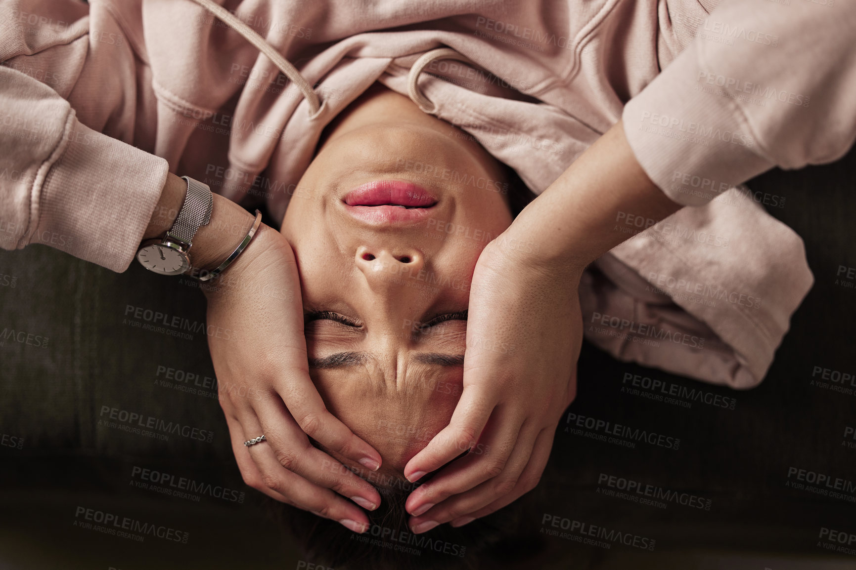 Buy stock photo High angle shot of an attractive young woman suffering from depression against a green background