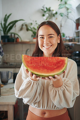 Buy stock photo Shot of a young woman holding some watermelon before eating it
