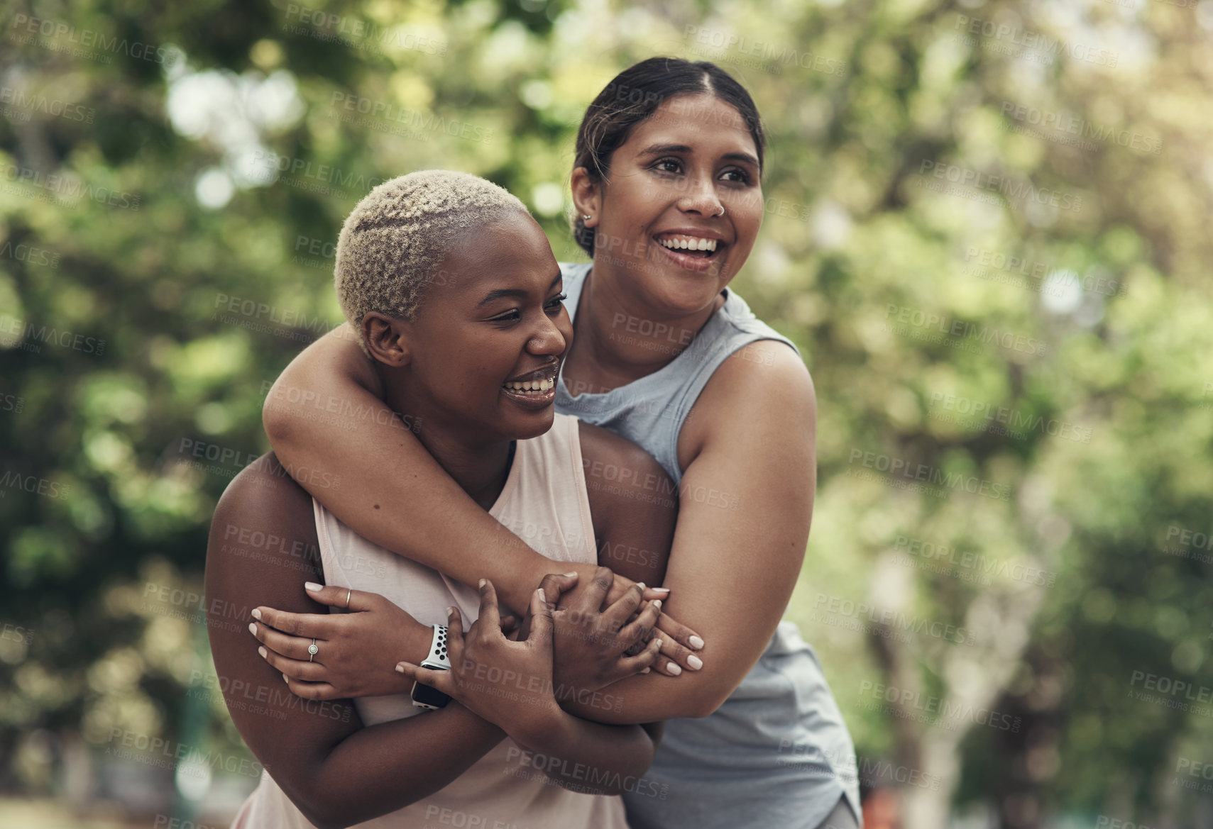 Buy stock photo Shot of two female friends taking a break during their workout