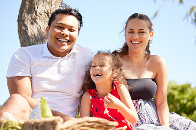 Buy stock photo Shot of a little girl on a picnic at the park with her parents