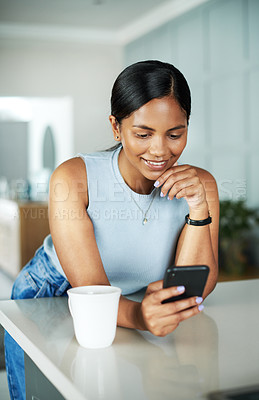 Buy stock photo Smile, coffee and woman on cellphone in kitchen networking on website, internet or mobile app. Technology, happy and female person typing online email with phone by counter in apartment in morning.