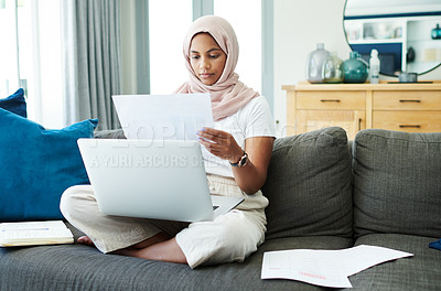 Buy stock photo Laptop, document and muslim woman in home for taxes, remote work or reading info for budget. Computer, paperwork or serious freelancer on couch with data, statistics and chart of financial consultant