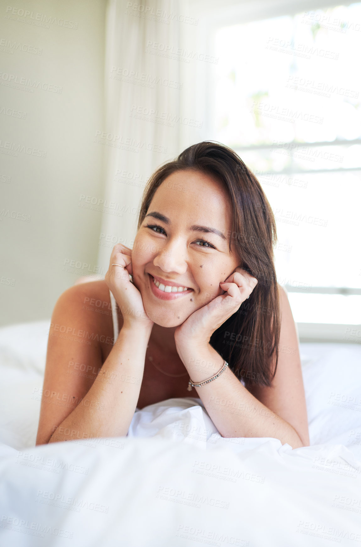 Buy stock photo Morning, portrait and happy woman wake up in bed on holiday or relax on vacation with a smile. Healthy, rest and Asian girl with positive attitude ready to start weekend with wellness in home