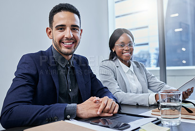 Buy stock photo Portrait of two businesspeople having a meeting in an office