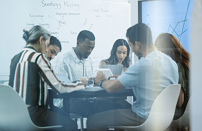 Buy stock photo Shot of a group of business colleagues brainstorming during a meeting