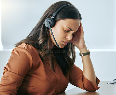 Buy stock photo Mental health, woman with headset and headache at desk at her office at workplace with a lens flare. Stress or burnout, sad and female person at call center or telemarketing with migraine pain