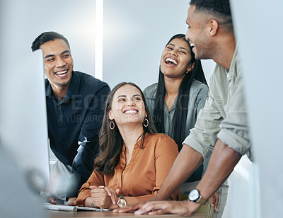 Buy stock photo Shot of a diverse group of businesspeople standing together in the office and using a computer