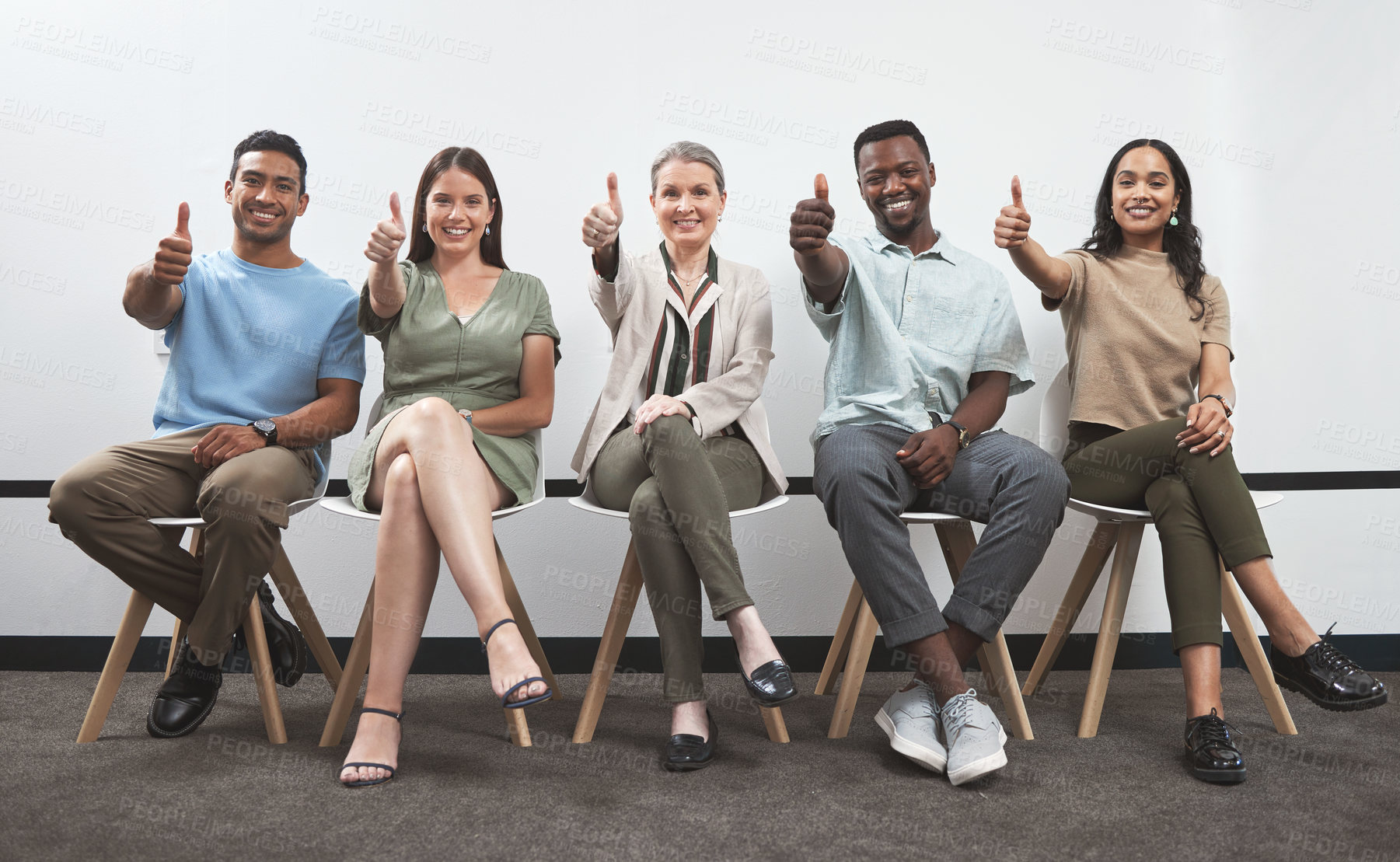 Buy stock photo Creative people, portrait and thumbs up with row, line or waiting room for good job or teamwork at office. Group of employees with smile, like emoji or yes sign for success, interview or startup