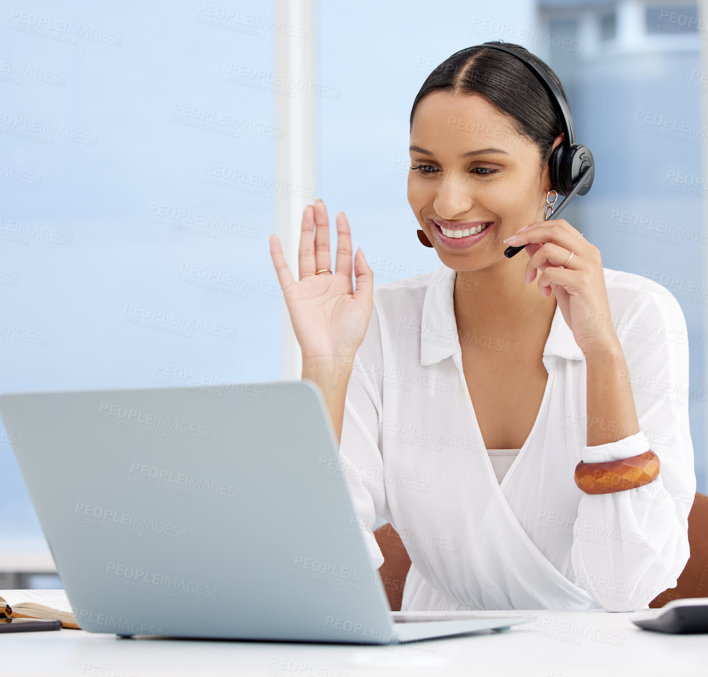 Buy stock photo Shot of a young businesswoman on a call using a headset in a modern office