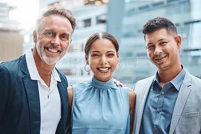 Buy stock photo Portrait of a group of businesspeople standing together against a city background