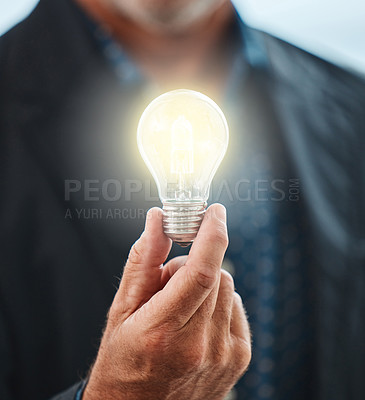 Business, man and hand with light for idea, innovation and creative knowledge for vision for sustainability. Growth, solution and renewable energy, electricity and power saving for eco plan 