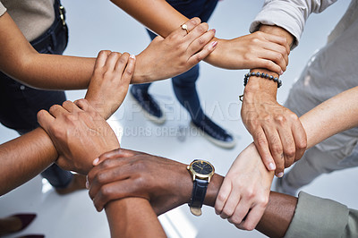 Buy stock photo Wrist, hands and teamwork of group in support, diversity and collaboration from above. Closeup, people and holding arm in link, solidarity or cooperation of partnership, team building or circle union