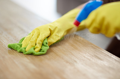 Buy stock photo Gloves, cleaning surface and person with wooden surface, spray bottle or hygiene with sanitary. Cleaner, housekeeper or employee with equipment, remove bacteria or disinfect table with chemical spray