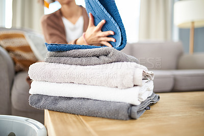 Buy stock photo Cleaning, laundry and towels with hands of woman in living room for hygiene, washing and housekeeping. Fabric, cleaner and cotton with closeup of person at home for tidy, organizing and textile 