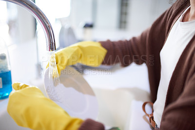 Buy stock photo Water, hands and gloves for cleaning plate, dirty dishes and person with house work for hygiene and routine. Tap, sink and remove bacteria or germs in kitchen, sustainability and housekeeping