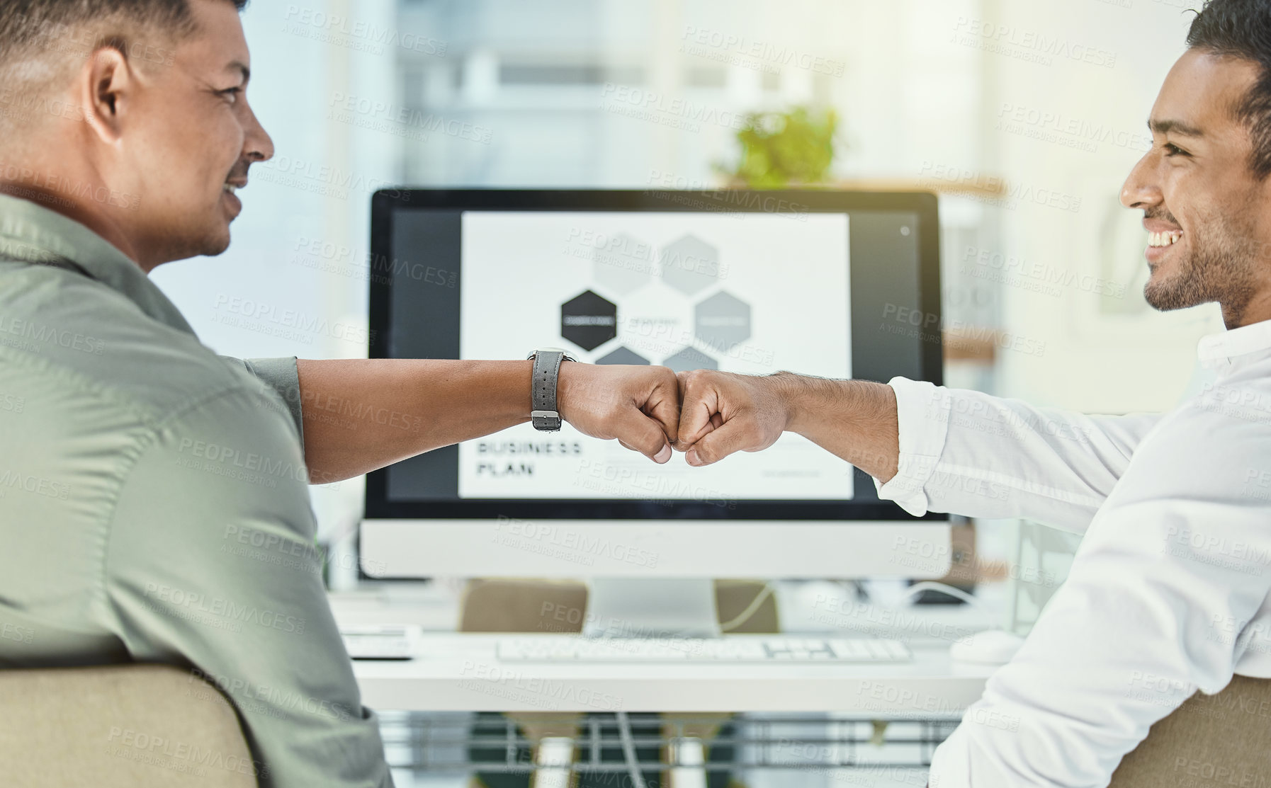 Buy stock photo Shot of two businessmen sharing a fist bump