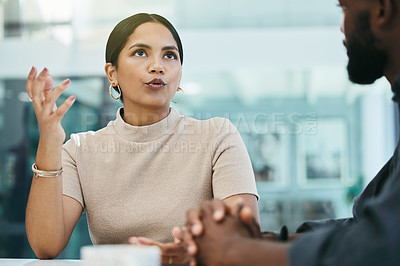 Buy stock photo Shot of a businesswoman and her coworker during a meeting