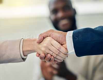 Buy stock photo Shot of two businesspeople shaking hands in agreement