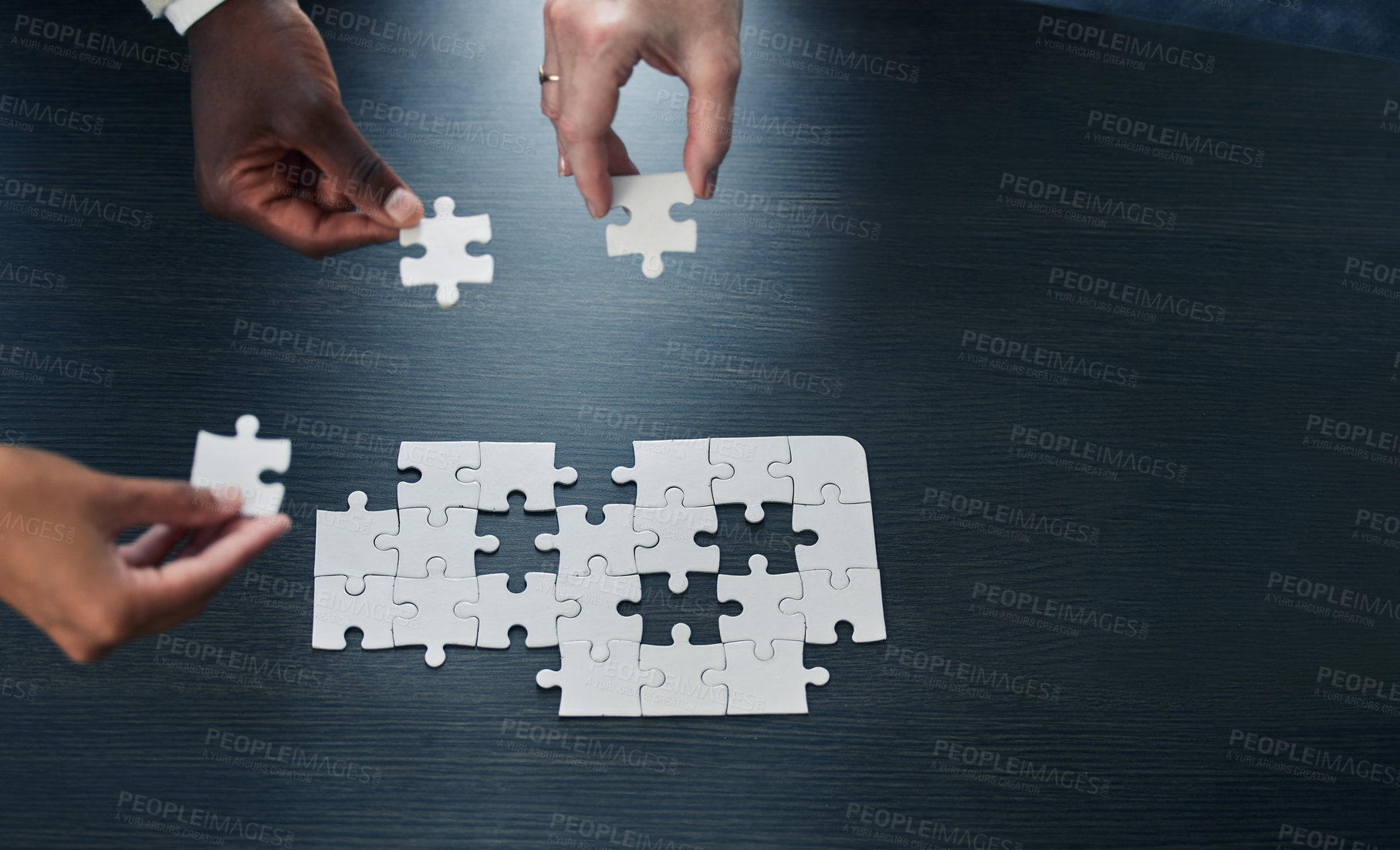 Buy stock photo Business people, hands and puzzle for problem solving, team building or collaboration on mockup. Hand of group in jigsaw solution, planning or teamwork for development above on mock up space