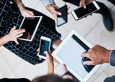 Buy stock photo Cropped shot of the hands of businesspeople using various devices