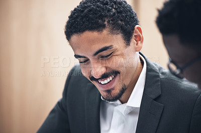 Buy stock photo Shot of a businessman sitting with his coworker