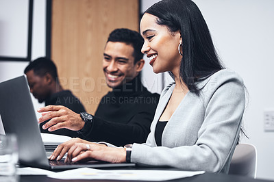 Buy stock photo Shot of a young businesswoman using a laptop while working