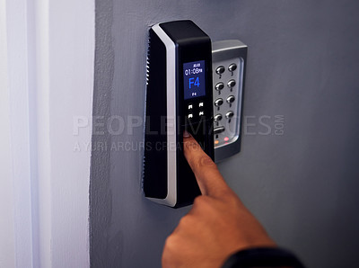 Buy stock photo Shot of an unrecognizable man using his finger to gain access into a building