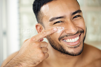 Buy stock photo Man, bathroom and skincare with moisture, portrait and smile for health, cosmetics and self care in morning. Indian guy, skin wellness and youth for natural glow, cream and happiness with routine