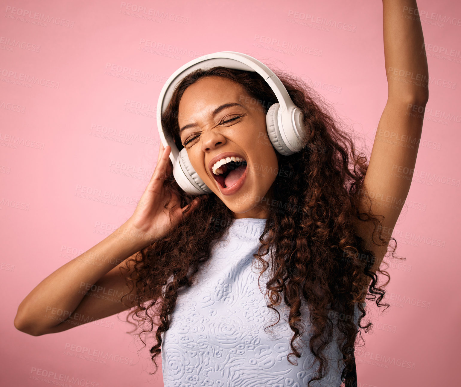 Buy stock photo Excited girl, listening and music with headphones for hip hop, rock or beats on a pink studio background. Happy female person or model enjoying podcast, audio streaming or sound for dance or energy