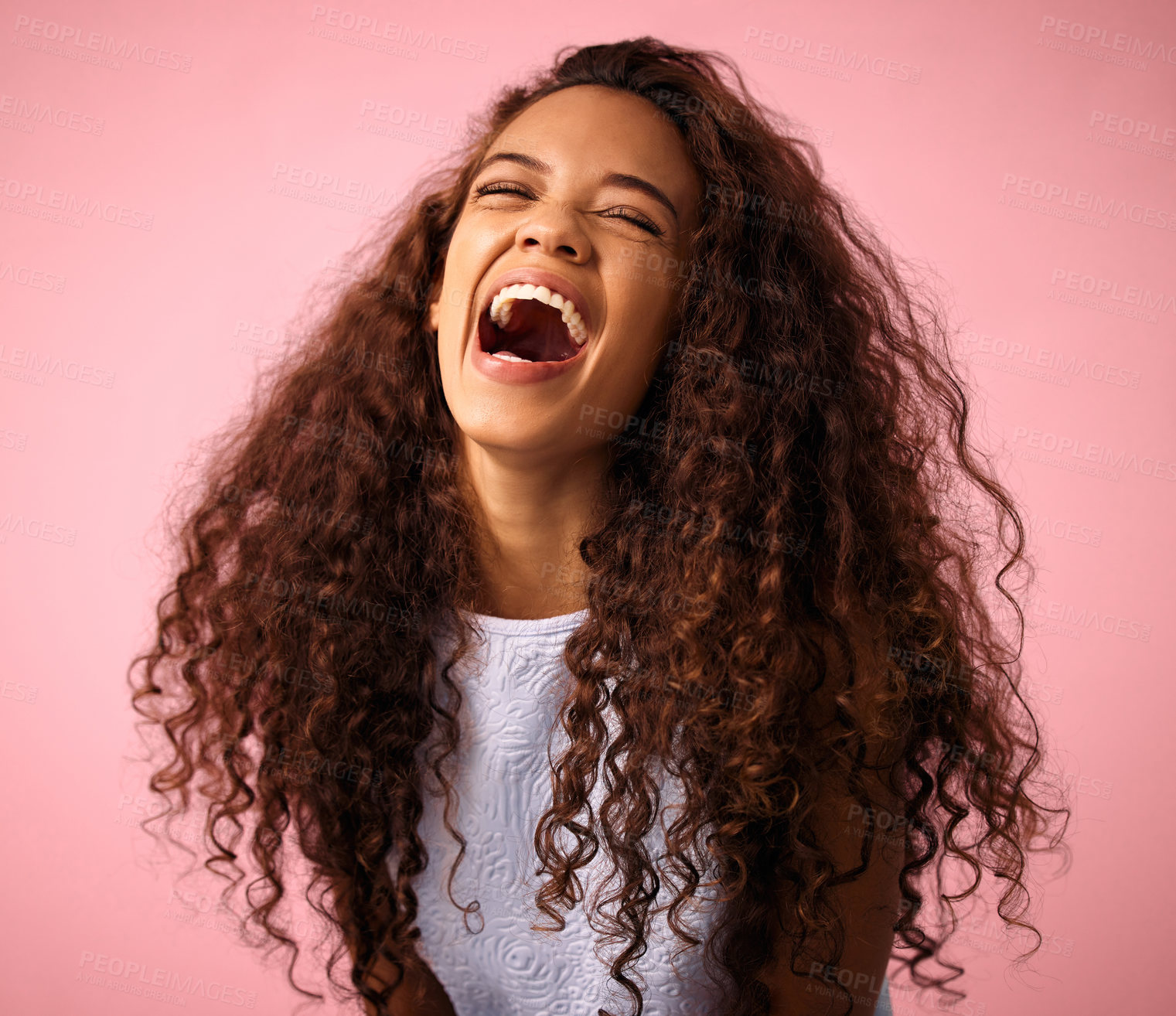 Buy stock photo Girl, happy and excited with hair in studio on pink background for treatment, growth and care. Laugh, gen z and isolated with trendy or natural hairstyle, curls and soft with fresh texture.
