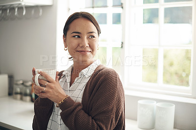 Buy stock photo Woman, relax and thinking with coffee in kitchen for holiday, satisfaction and winter vacation. Asian person, happy and hand with mug for warm beverage, morning routine and weekend enjoyment at home
