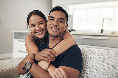 Buy stock photo Portrait, home and hug with couple, relax and happiness with love or bonding together in lounge. Face, apartment or man with woman or embrace with romance or relationship with marriage, care or trust